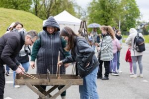 Outdoor Games Festival in Šiauliai, Lithuania: people playing large wooden games, photo 6